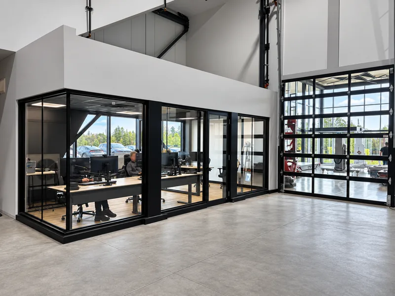 INOGEC glass-enclosed engineering offices beside the workshop