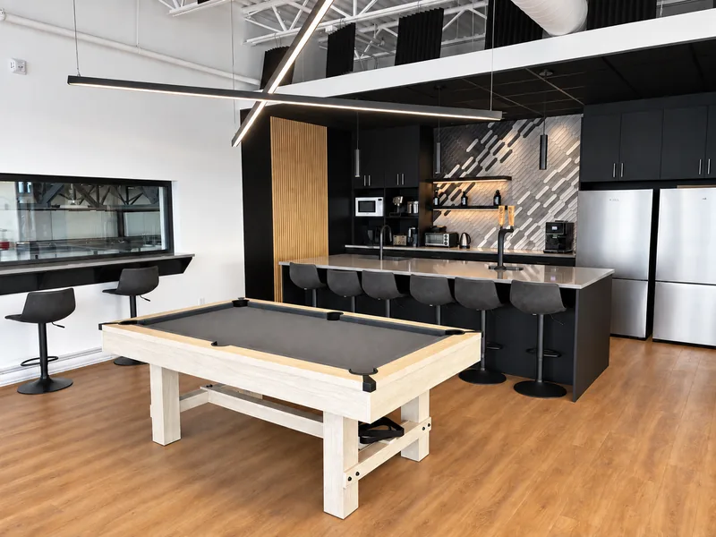 Shared kitchen and pool table inside INOGEC